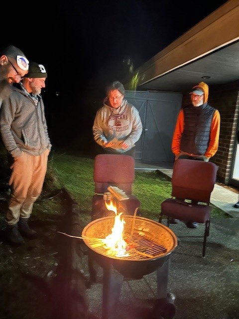 Parishioners gathered outside Faith Episcopal for the burning of palms